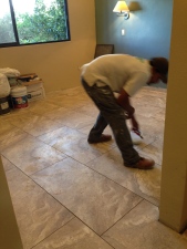 Richard artistically working on the tile
